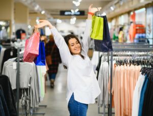 Woman in shopping. Happy woman with shopping bags enjoying in shopping.